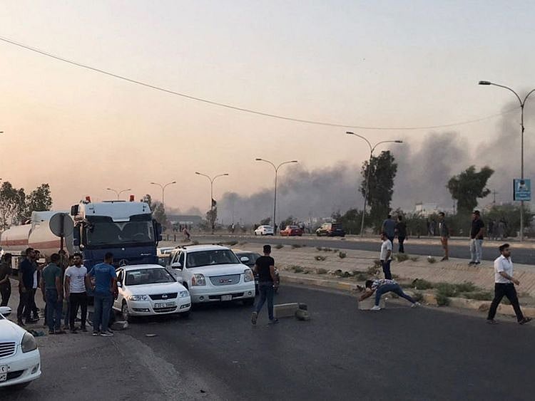 Iraqi protesters block a road following protests in the multi-ethnic Iraqi city of Kirkuk on September 2, 2023.  