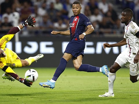 Paris St Germain's Kylian Mbappe scores their fourth goal Soccer during the Ligue 1 match against Olympique Lyonnais at Groupama Stadium, Lyon on Sunday.