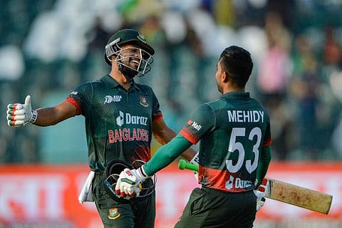 Bangladesh's Mehidy Hasan Miraz (right) celebrates with Najmul Hossain Shanto after scoring a century during the Asia Cup 2023 ODI against Afghanistan at the Gaddafi Stadium in Lahore on Sunday.