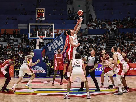 Spain's Willy Hernangomez (right) and Canada's Dwight Powell jump for the ball during the Fiba Basketball World Cup Group L match at Indonesia Arena in Jakarta on Sunday.