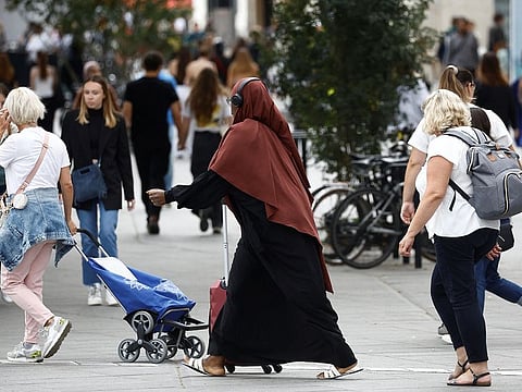 A woman wearing an abaya walks on a street in Nantes, France, August 29, 2023. 