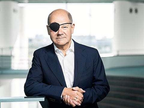 This handout photo provided by the German government press office, Bundespresseamt, shows German Chancellor Olaf Scholz with a black eye-pad  at the chancellery in Berlin, Monday, Sept. 4, 2023. German Chancellor Olaf Scholz has tweeted a pirate-style picture of himself with a black eye patch and dark-red bruises on the right side of his face — the result of a jogging accident on the weekend. 