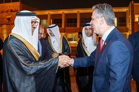 Bahrain's Foreign Minister Abdul Latif Al Zayani receiving his Israeli counterpart Eli Cohen upon his arrival in Manama.  