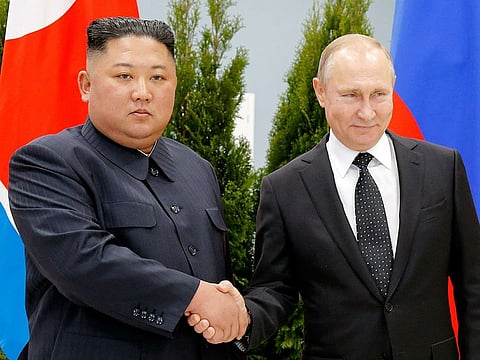 Russian President Vladimir Putin, right, and North Korea's leader Kim Jong Un shake hands during their meeting in Vladivostok, Russia on April 25, 2019.