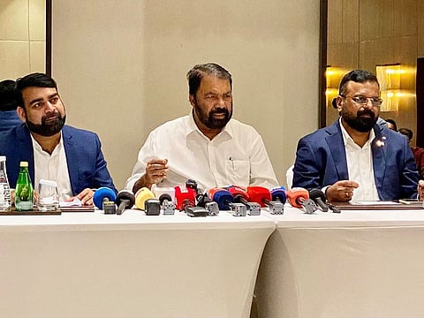 Kerala minister V Sivankutty (centre) addresses the media in Dubai on Tuesday. He is flanked by Adv KP Anilkumar, chairman ODEPC (right) and Anoop K Achuthan, managing director, ODEPC.