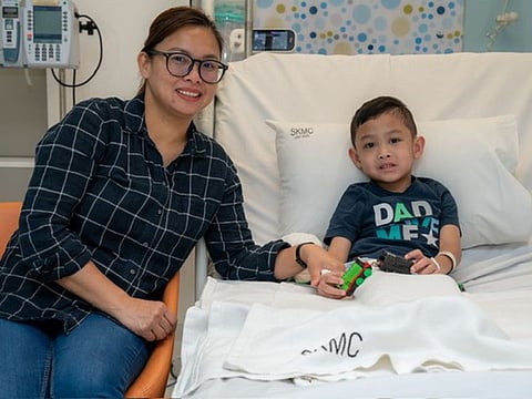 A 5-year-old boy with his mother at Sheikh Khalifa Medial City after successful treatment of rare rheumatological disease