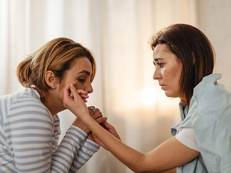 Two people crying