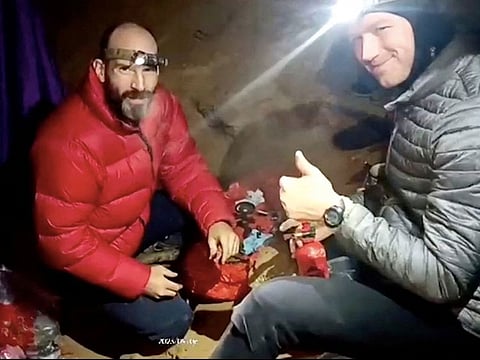 US explorer Mark Dickey is seen next to a rescuer inside the Morca Cave, near Anamur in Mersin province, southern Turkey.