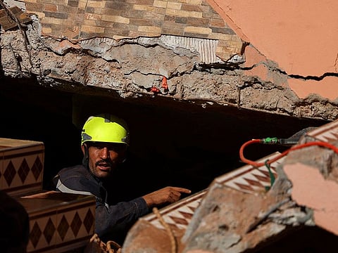 A rescue worker takes part in a search and rescue operation, in the aftermath of a deadly earthquake in Ouirgane, Morocco