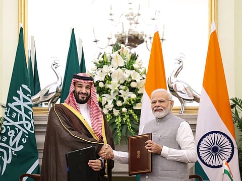 Saudi Crown Prince Mohammad bin Salman and India's Prime Minister Narendra Modi  exchange agreements, at Hyderabad House, in New Delhi on Monday.  