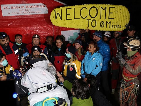 US caver Mark Dickey, on a stretcher, talks to reporters as his rescue operation comes to a successful end near Anamur in Mersin province, southern Turkey.