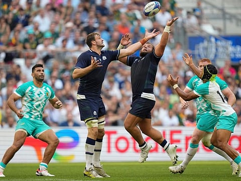 Scotland's Richie Gray (centre left) and his teammate Pierre Schoeman, try to catch the ball during the Rugby World Cup Pool B match at the Stade de Marseille in Marseille, France.