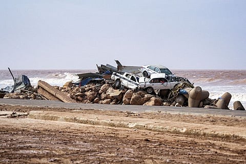 Vehicles pile up along the side of a coastal road in the eastern city of Derna, about 290 kilometres east of Benghazi, in the wake of the Mediterranean storm "Daniel".  