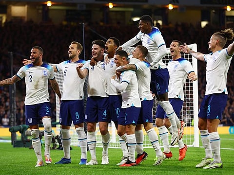England's Jude Bellingham celebrates scoring their second goal with teammates during the international friendly against Scotland in Glasgow, Scotland on Tuesday.