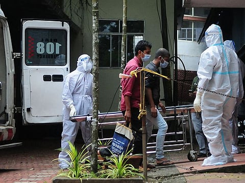 Health workers wearing protective gear shift people who have been in contact with a person infected with the Nipah virus to an isolation centre at a goverment hospital in Kozikode, in India's Kerala state on September 14, 2023. 