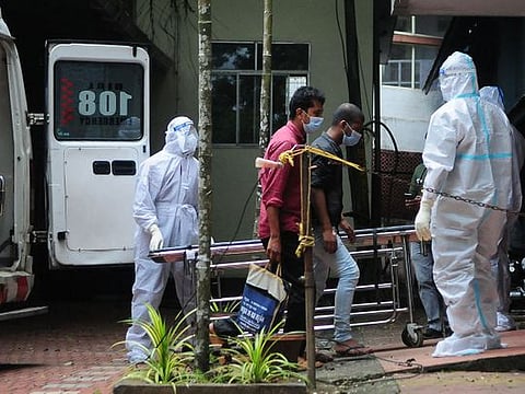 Health workers wearing protective gear shift people who have been in contact with a person infected with the Nipah virus to an isolation centre at a goverment hospital in Kozikode, in India's Kerala state on September 14, 2023. 