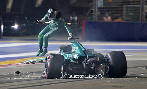 Aston Martin's Lance Stroll gets out of the car after crashing during the Singapore Grand Prix qualifying at Marina Bay Street Circuit, Singapore on Saturday.