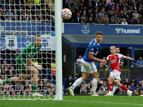 Arsenal's Leandro Trossard scores their first goal past Everton's Jordan Pickford during a Premier League match at Goodison Park on Sunday.
