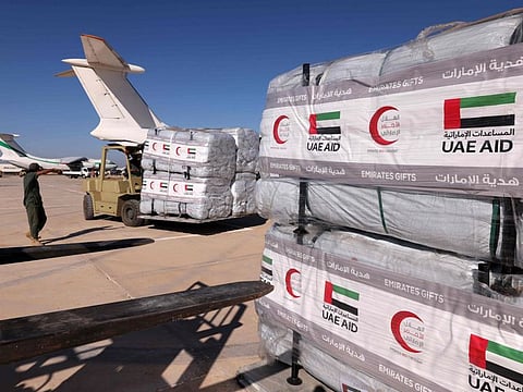 Aid supplied by the UAE for flood survivors being unloaded at Benghazi airport on September 16, 2023.  