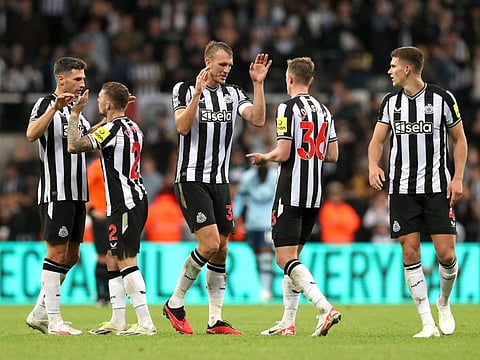 Newcastle United's Dan Burn and Sean Longstaff celebrate after a Premier League match against Brentford at St James' Park, Newcastle on September 16.