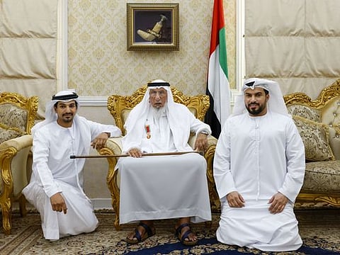 Family friends of Al Neyadi: Ali Al Ahbabi (centre), with his sons Humaid Ali Al Ahbabi (right) and Awad Ali Al Ahbabi, at their residence in Al Ain