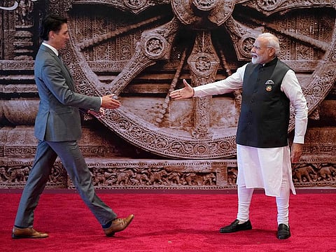 India's Prime Minister Narendra Modi  with Canada's Prime Minister Justin Trudeau ahead of the G20 Leaders' Summit in New Delhi on September 9, 2023.  