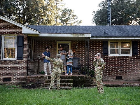 Airmen from Joint Base Charleston speak to a family living right next to the site of a crashed F-35.