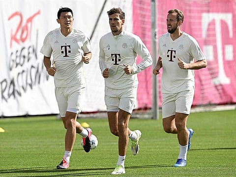 Harry Kane (right) trains with South Korean defender Kim Min-jae  and Leon Goretzka ahead of Bayern Munich's Champions League match.