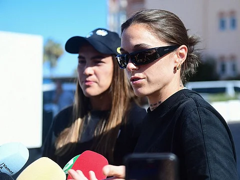 Spain's midfielder Patri Guijarro (L) and defender Mapi Leon talk to the press after announcing they are leaving the national selection, in front of their hotel in Oliva near Valencia, on September 20, 2023 ahead of the UEFA Nations League football matches against Sweden and Switzerland. 