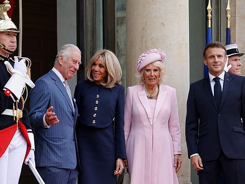 Britain's King Charles III French president's wife Brigitte Macron, Britain's Queen Camilla and French President Emmanuel Macron pose as they arrive at the Elysee Palace in Paris on September 20, 2023, on the first day of a state visit to France.  