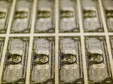 FILE PHOTO: U.S. dollar bills are seen on a light table at the Bureau of Engraving and Printing in Washington, November 14, 2014. REUTERS/Gary Cameron/File Photo
