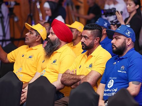 Workers at a Taqdeer Awards press conference. 