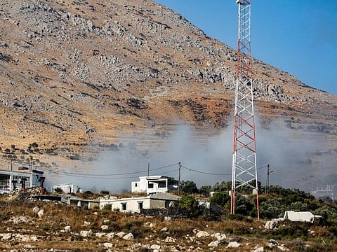 This picture taken from the Druze village of Majdal Shams in the Israel-annexed Golan Heights shows smoke billowing from a Syrian position along the front after Israeli bombardment on September 21, 2023. 