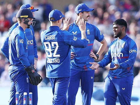 England's Rehan Ahmed (R) celebrates with teammates after bowling out Ireland's Andy McBrine during the second ODI  at Trent Bridge cricket ground in Nottingham on September 23, 2023.  