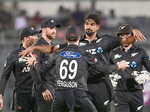 New Zealand's Ish Sodhi (2R) celebrates with teammates after taking the wicket of Bangladesh's Soumya Sarkar during the second ODI at the Sher-e-Bangla National Cricket Stadium in Dhaka on September 23, 2023.  
