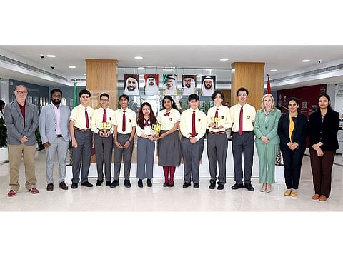 UAE’s GCS Spark Plugs from Sharjah-based GEMS Cambridge International Private School flanked by their teachers display their trophy haul including the coveted 'Rising All-Star Award'