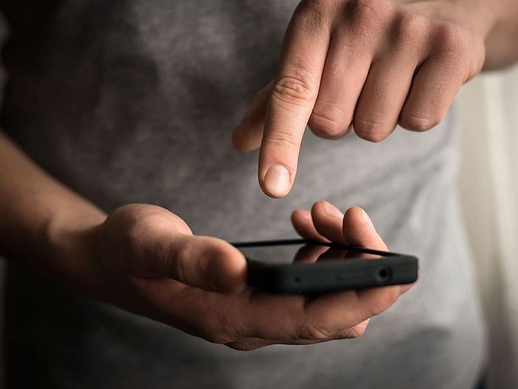 STOCK Man using phone smartphone text