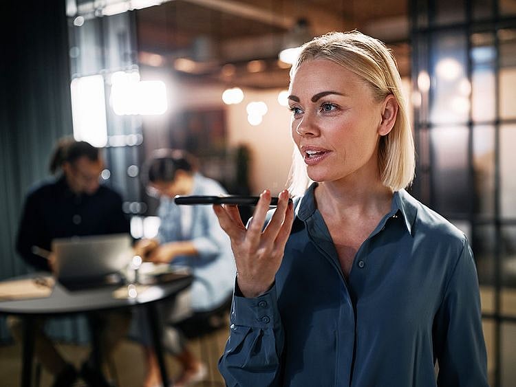 shutterstock_1789574780 talking on phone speaker phone