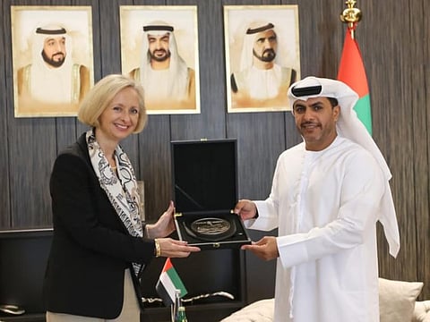 UAE Minister of Justice Abdullah Sultan bin Awad Al Nuaimi with  Martina Strong, Ambassador of the United States of America to the UAE