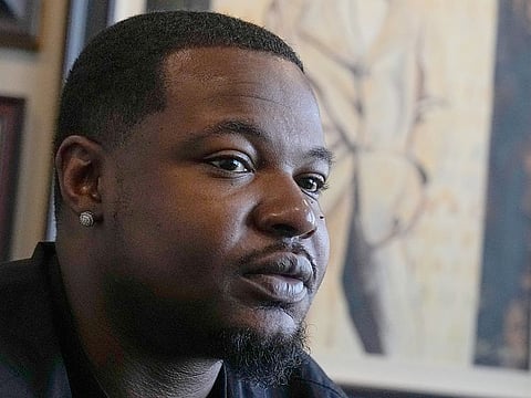 Randal Quran Reid speaks at his attorny's office. 