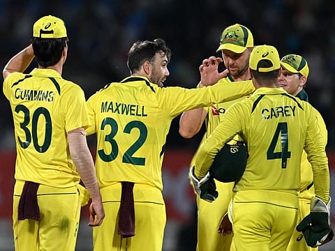 Australia's Glenn Maxwell (centre) celebrates with teammates after removing India's captain Rohit Sharma during the third and final One Day International match at the Saurashtra Cricket Association Stadium in Rajkot on Wednesday.
