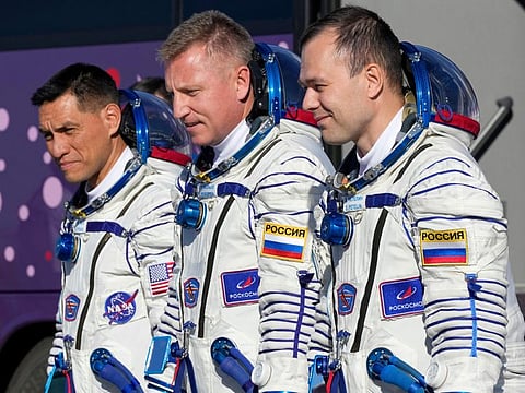 From left, NASA astronaut Frank Rubio, Roscosmos cosmonauts Sergey Prokopyev and Dmitri Petelin, crew members of the mission to the International Space Station (ISS), walk to the rocket prior the launch of Soyuz-2.1 rocket, at the Russian leased Baikonur cosmodrome, Kazakhstan, Wednesday, Sept. 21, 2022.