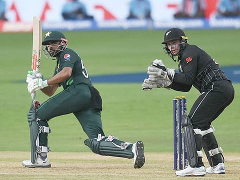 Pakistan’s captain Babar Azam (left) plays a shot during a warm-up match against New Zealand ahead of the ICC Men’s Cricket World Cup, at the Rajiv Gandhi International Cricket Stadium in Hyderabad on September 29, 2023.  