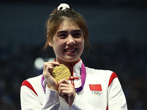 Gold medallist China's Zhang Yufei poses during the medal ceremony for the women's 50-metre butterfly in the Asian Games on Friday..