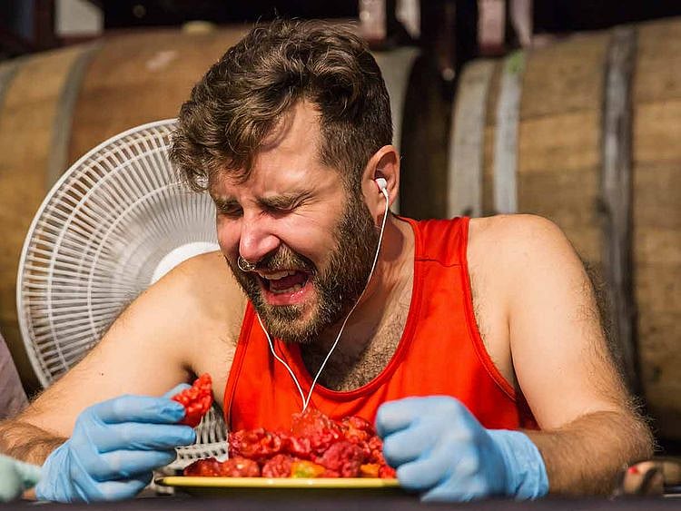 Mike Jack set a Guinness World Record by eating 50 California Reaper peppers in six minutes and 49 seconds. The peppers are known as the world's hottest.