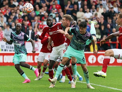 Nottingham Forest's Cheikhou Kouyate in action with Brentford's Nathan Collins during a Premier League match at the City Ground, Nottingham on Sunday.