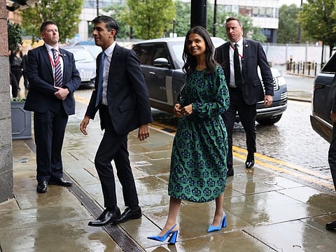 Rishi Sunak and his wife Akshata Murty, arrive on the opening day of the UK Conservative Party Conference in Manchester, UK, on  October 1, 2023.  