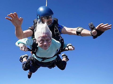 Dorothy Hoffner, 104, falling through the air with tandem jumper Derek Baxter as she becomes the oldest person in the world to skydive.