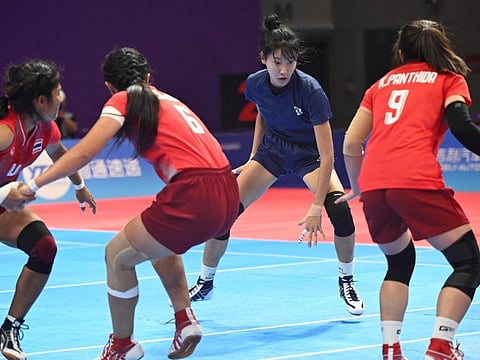 South Korea's Woo Hee-jun competes in the woman's team group kabaddi event against Thailand during the Asian Games in Hangzhou on Monday.