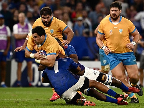 Uruguay's hooker Facundo Gattas is tackled during the Rugby World Cup Pool A match against Namibia at OL Stadium in Lyon, south-eastern France, on September 27.